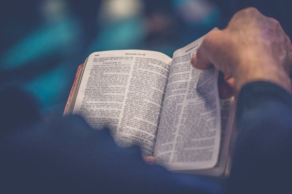 Open Bible on wooden table